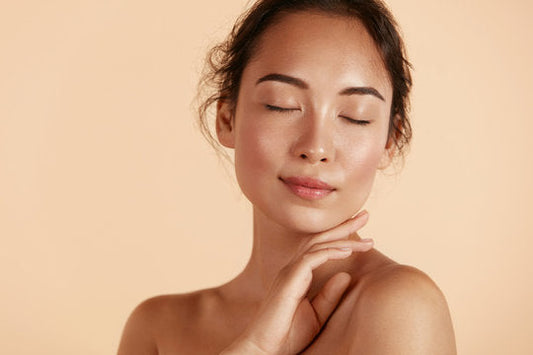 woman closing her eyes with makeup on